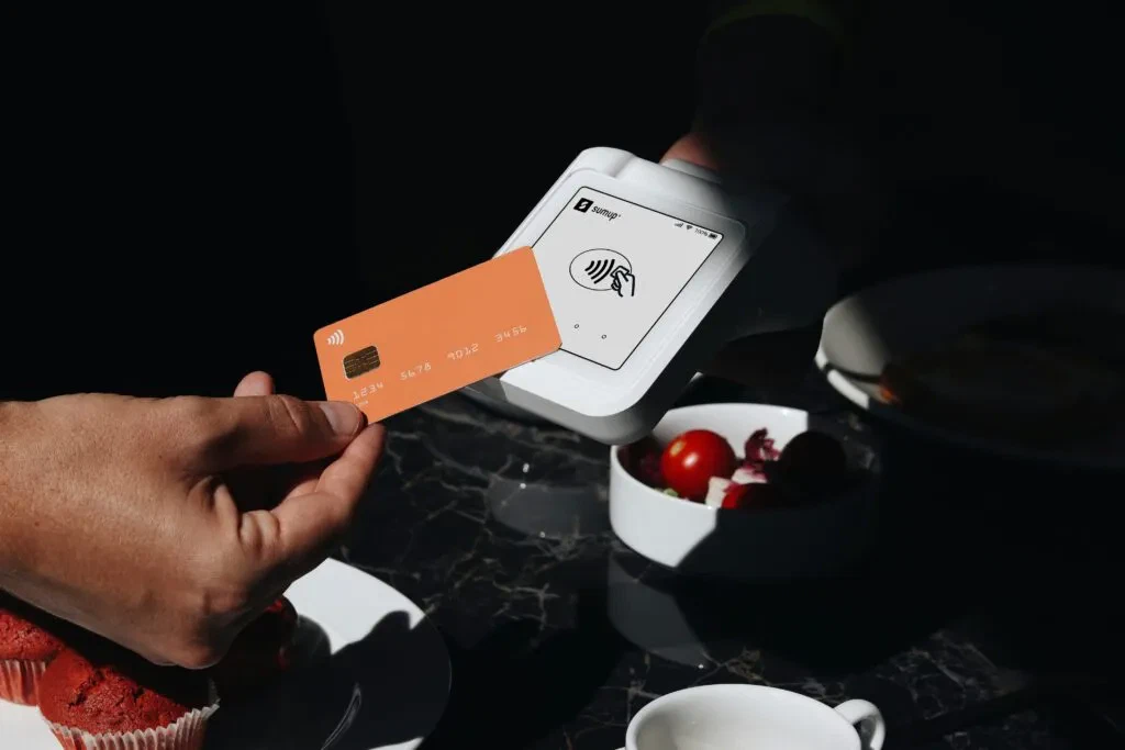 Contactless payment with a SumUp card reader. Paying for fintech services in Australia.