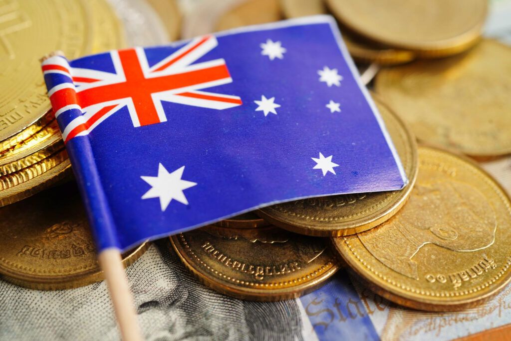 Australian flag on gold coins and currency, representing stablecoin redemption rights.