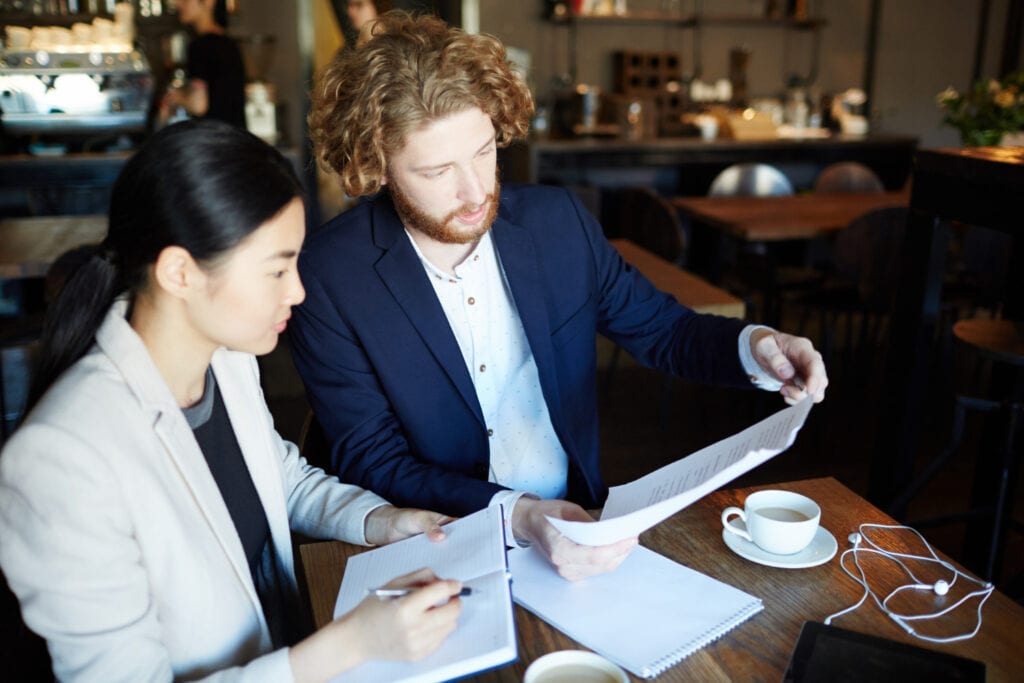 Business meeting discussing ASIC CFD rules and regulatory requirements