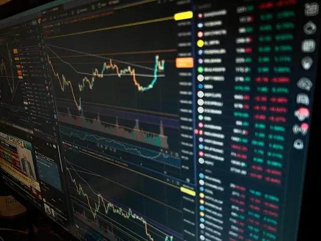 Crypto trading screen with charts and stock data. Starting a crypto exchange requires technical analysis.