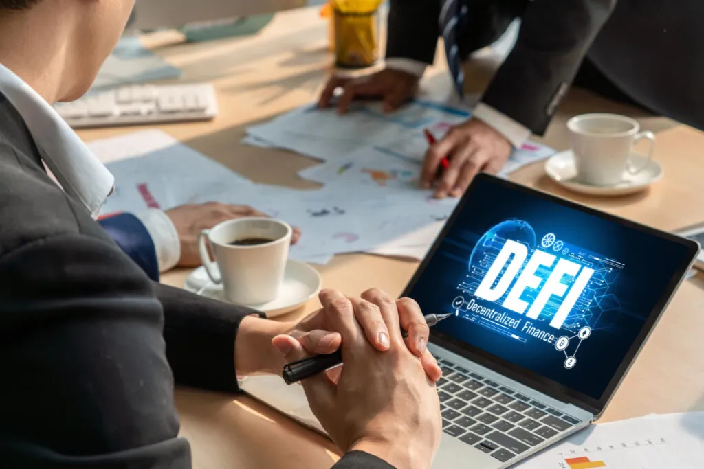 DeFi concept on laptop screen in business meeting. Decentralized Finance.